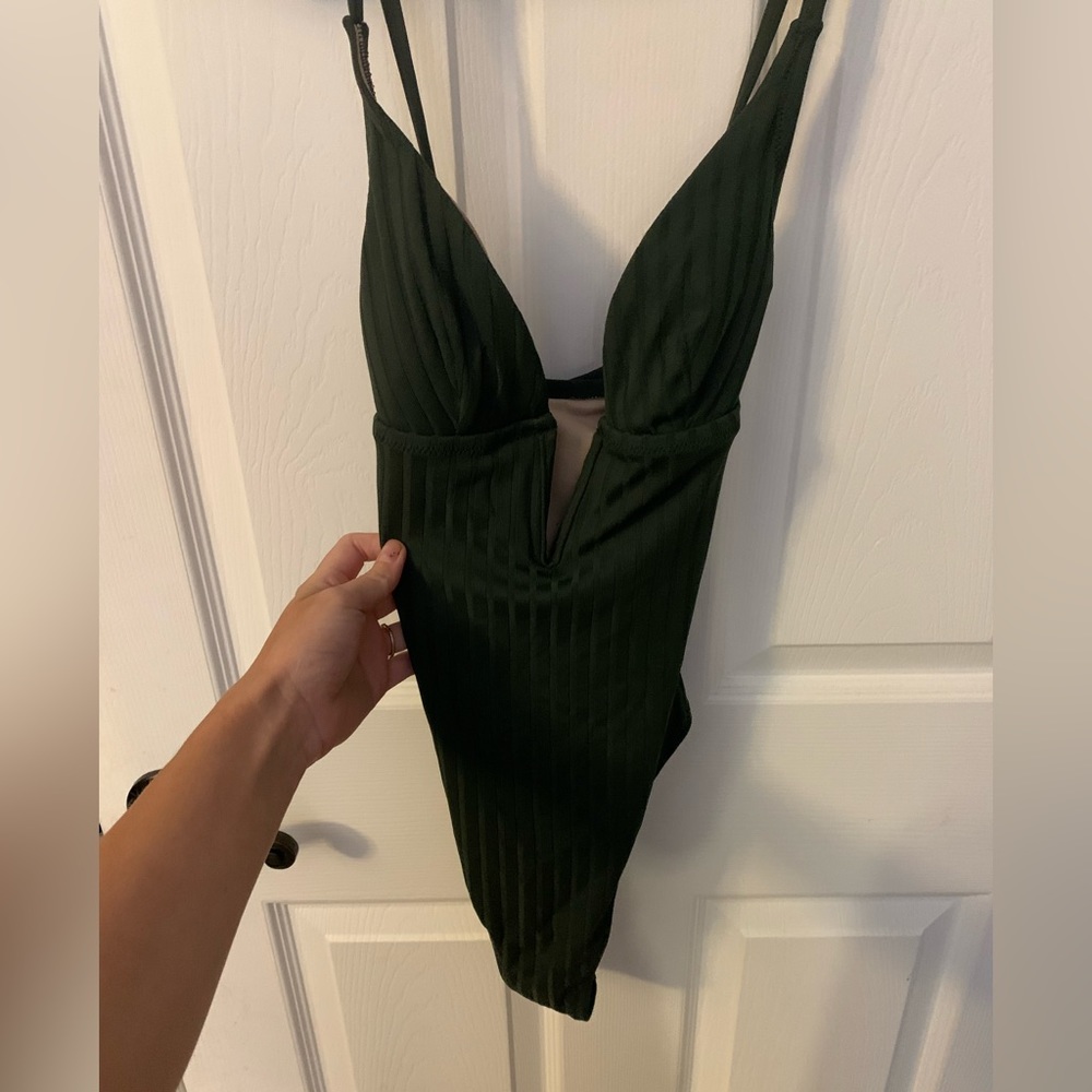 small shade & shore green one piece w/ plunge neckline & cheeky butt